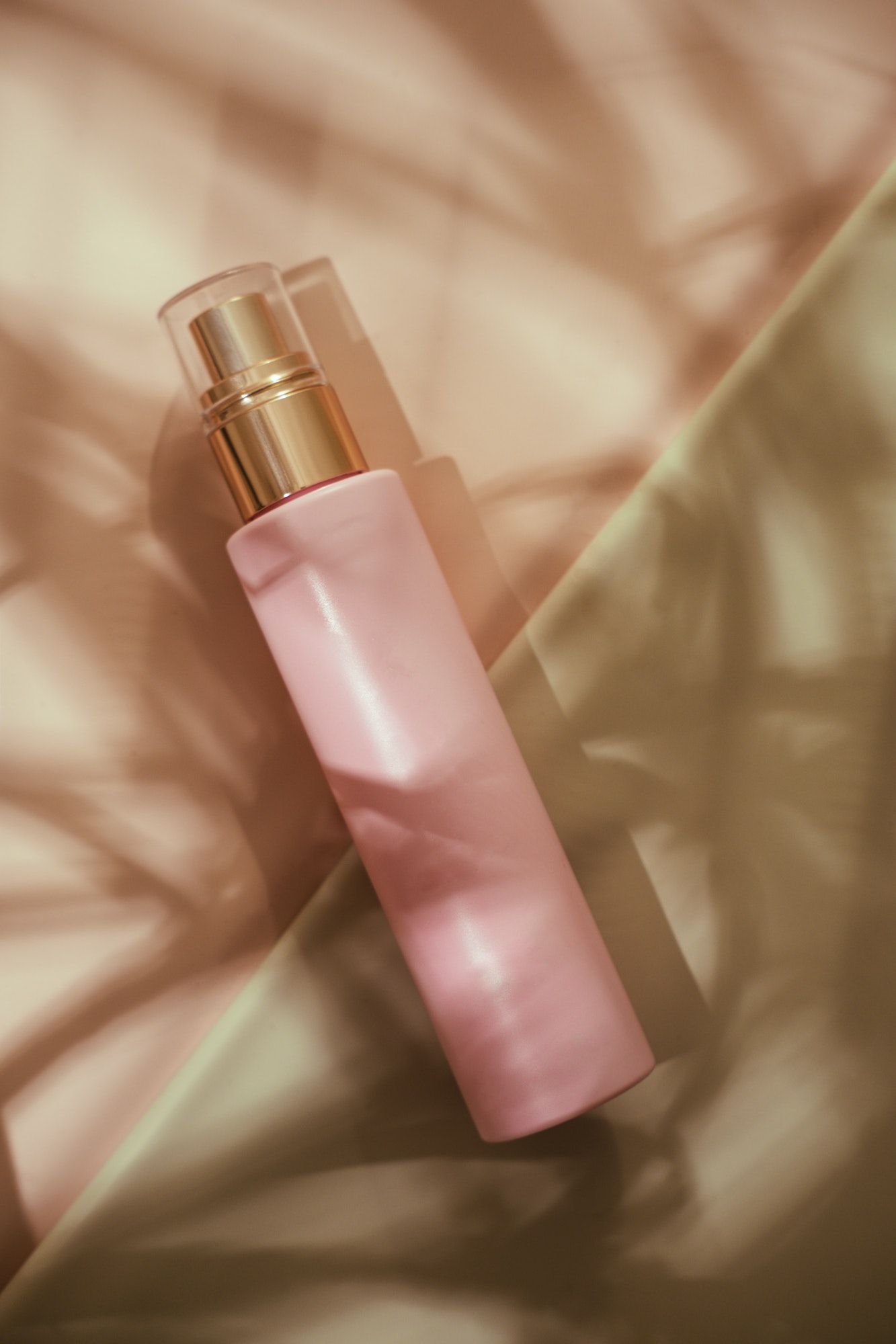 Pink cosmetic beauty bottle minimalist flatlay